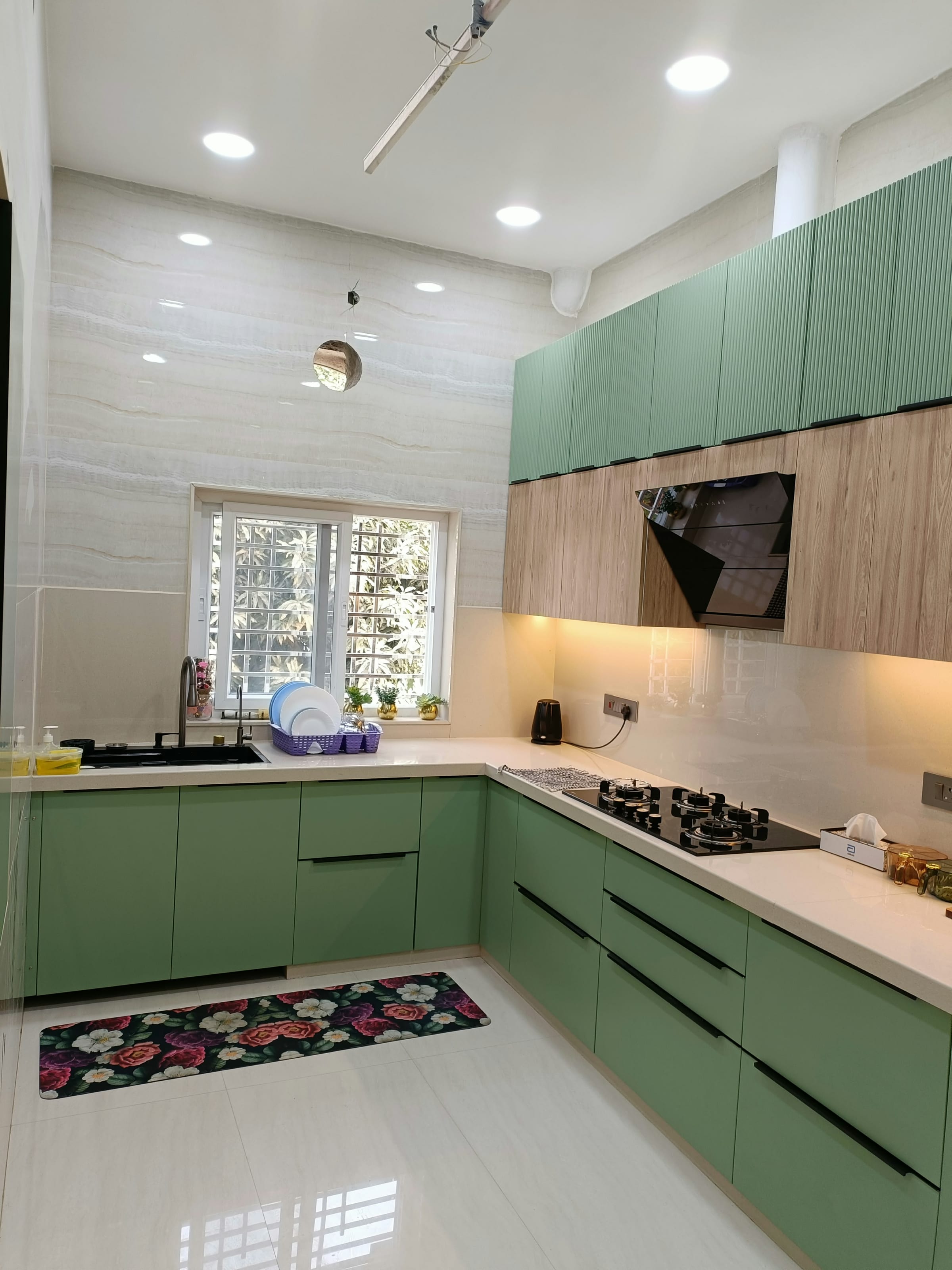An L-shaped green modular kitchen we built in Gorakhpur