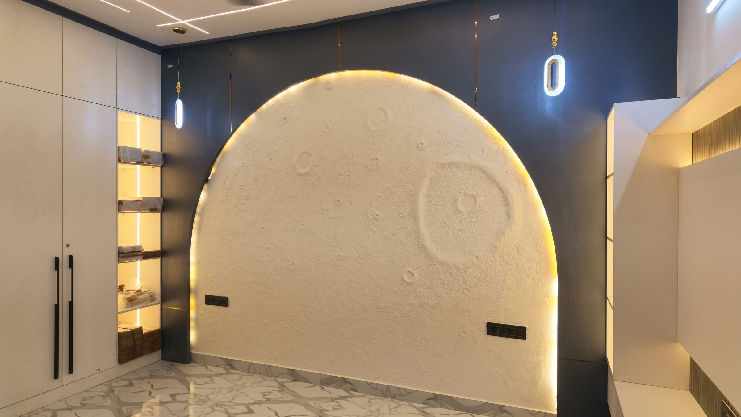 A bedroom wardrobe beside a textured moon wall design